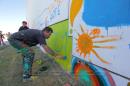 Chicos dejan su huella en el Mural de la Sarmiento